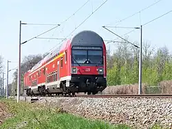 Modernized double-decker train of S1 with a 1992 control car in April 2010 between Leipzig-Leutzsch and Leipzig-Möckern in typical "DB-red" now