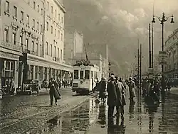Rainy street with tram in Brussels, 1937