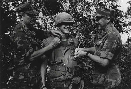 A United States Marine receives a promotion to first lieutenant