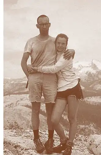 Liz and Royal Robbins smiling after their climb