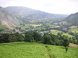 A village sitting in an agrarian valley.