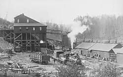 Locomotive hauling ore cars, Beaver Hill Coal Mine mill, circa 1912