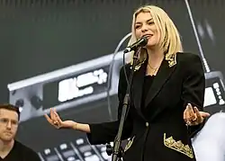 Lola Lennox performing on stage in Anaheim, California in 2018