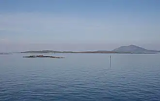Killegray from the southeast with the heights of Ceapabhal on Harris beyond