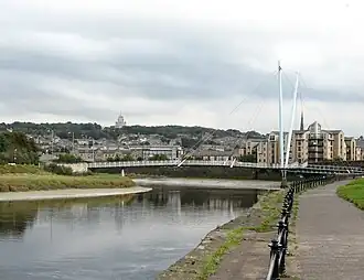Lune at the Lune Millennium Bridge, with Lancaster in background