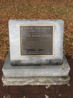 A plaque from the National Park Service declaring the site of the riot to be a National Historical Site