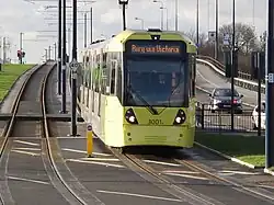 A M5000 tram having just left Ashton West