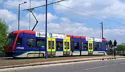 Sideways view of tram 06 in original livery