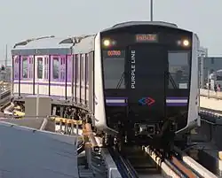 MRT Purple Line train entering a station.