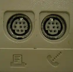 Pair of female Mini DIN-8 connectors used for RS-422 serial ports on a Macintosh LC computer.