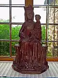 Wooden sculpture depicting madonna and child.