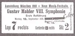 A rectangular card, the main text of which reads "Ausstellung München 1910. Neue Musik-Festhalle. Gustav Mahler&nbsp;VIII. Symphonie, Erste Aufführung, Montag 12. September 1910."