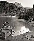 Major John Wesley Powell's boat with famous armchair. Apollo Temple in the distance. circa 1869