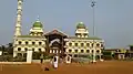 The expanded mosque and dargah, with the old mosque in centre