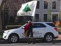 Man in Colonial American costume with the flag, March 2013