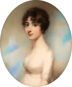 oval-shaped portrait of a thin, white, young woman with dark hair