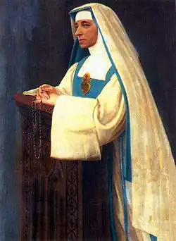 The religious habit of the Sisters of Mary Reparatrix is white, with a blue scapular, a white and blue veil and a large golden heart on the breast.