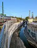 After crossing to the north of Lambert Ave in Palo Alto, Matadero Creek makes a turn to the southeast along the Caltrain tracks before crossing under them.