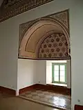 Interior of the pavilion, with stucco decoration around a window