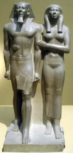Image 11Greywacke statue of the pharaoh Menkaure and his queen consort, Khamerernebty II. Originally from his Giza temple, now on display at the Museum of Fine Arts, Boston. (from History of ancient Egypt)