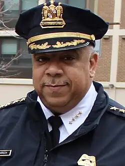 Close-up portrait of Tuggle smiling at a parade
