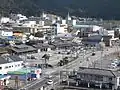 A good birds-eye view of the west side of the station. The low buildings with tiled roofs are part of the Hiwasa Road Station. The metal footbridge gives access to the east side of the station which is partly obscured by the bridge.