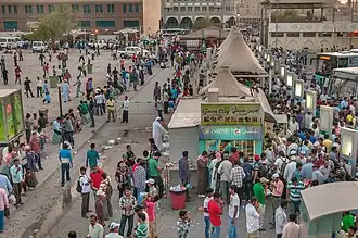Migrant workers at Al Ghanim Central Bus Station.