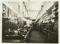 A long, glowing glass tube rings the room and hangs a few feet down from the ceiling.