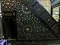 The minbar of the mosque, made of wood with geometric star patterns inlaid with ivory