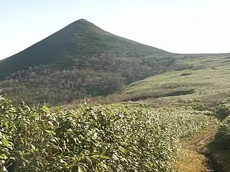A view of Mount Teshio, a relatively small mountain, covered in grass in this picture