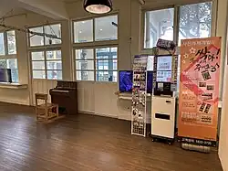 Interior of the gallery room, with a foot-powered organ (2023)