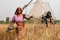 Tharu women in southwest Nepal with hexagonal hand lift nets