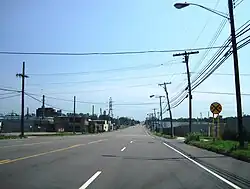 Hyde Park Boulevard (NY 61) southbound on the border of the town of Niagara and city of Niagara Falls (town on left)