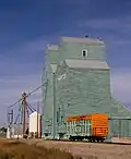 Former Alberta Wheat Pool elevators and box car.