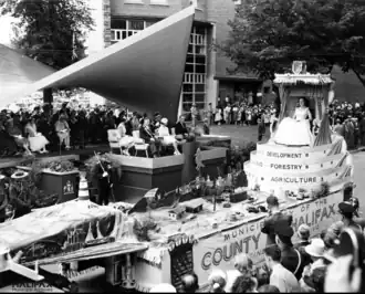 County Float in the 1958 Natal Day Parade with Miss Halifax County viewed by Princess Margaret, City of Halifax Mayor Charles Vaughan from the royal platform outside the CBC Television studios on Bell Rd.[13]