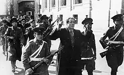 National police escorting members of the National Socialist Movement of Chile during the Seguro Obrero Uprising. On September 5, 1938, after four hours of fighting in Santiago, Chilean authorities rounded up and executed nearly sixty rebels who had surrendered. About twenty others were killed during the fighting.