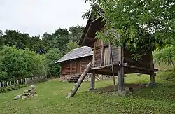 Reconstruction of Hallstatt-era buildings: House (left) and granary (right)