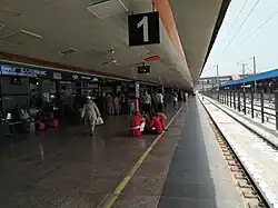 Porters awaiting a train's arrival.