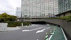 Hotel entrance with modern glass facade and circular driveway