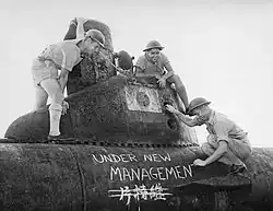 Image 65Australian sailors take possession of a midget submarine at a Japanese naval base near Tokyo in September 1945. (from History of the Royal Australian Navy)