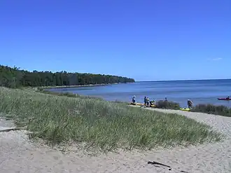 Looking north at the beach with kayakers