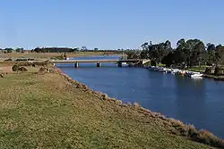 Looking south down the Nicholson River towards the Princes Highway road bridge from the East Gippsland Rail Trail