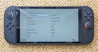 Nintendo Switch 2 in handheld mode with language selection menu displayed