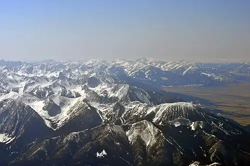 Northwest expanse of Absarokas as viewed from 15,000 feet (4,600&nbsp;m) over Livingston, Montana