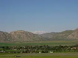 Nuevo, California. Distant view of snow-capped San Gabriel Mountains from Nuevo Road.