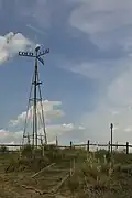Original mock weather vane monument at the tri-point prior to its demise in the 2010s. Also known as the 8-Mile Corner windmill. Replaced in 2024.