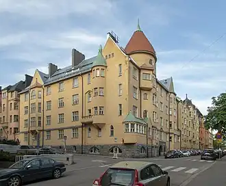 Olofsborg (apartment building) [fi] (Swedish for Olavinlinna, which the top resembles) at Katajanokankatu 1 / Kauppiaankatu 7, 1902