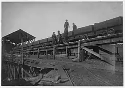 Child laborers on a minecart at Bessie Mine, Alabama, c. 1910-1911. Photo by Lewis Hine.