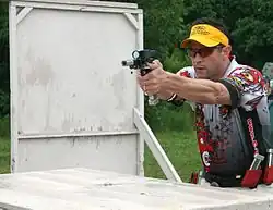 An Open division practical pistol shooter during a stage