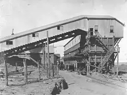 Ore conveyor to bedding bins (1912). Both were added as enhancements to the 1906 design.